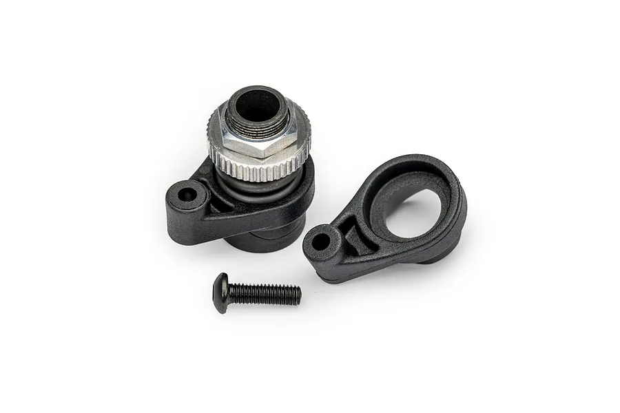 Traxxas servo horn and servo saver assembly components including a metal nut and a black screw on a white background.
