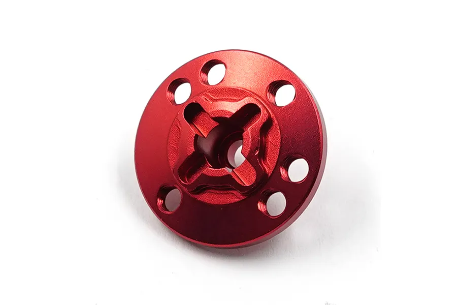 A red anodized aluminium spur gear mount for RC cars, featuring a circular design with a central cross-shaped cutout and multiple mounting holes.
