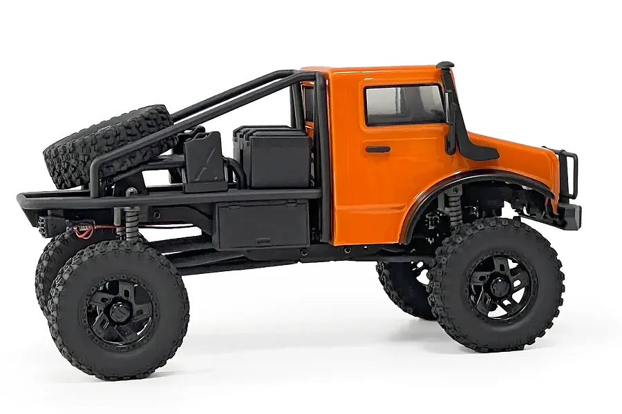 Side profile of an orange Hobby Plus CR-18P Evo Trail Hunter RC rock crawler with black roll cage, spare tire, and off-road accessories.