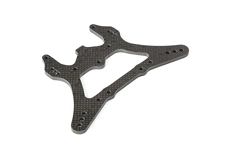 A flat, carbon fibre RC rear shock tower with multiple mounting holes, viewed from an angle against a white background.