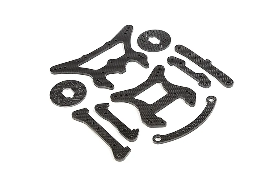 A set of Rovan carbon fibre RC car parts including shock towers, braces, and brake discs arranged on a white background.