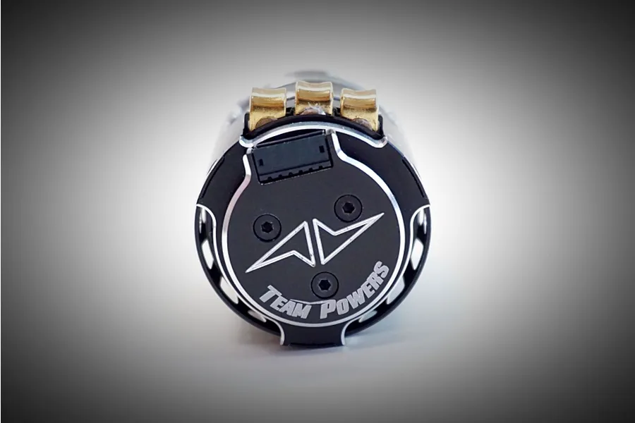 Rear view of a Team Powers Actinium V5 brushless motor showing the sensor port, three gold-plated solder tabs, and the Team Powers logo.