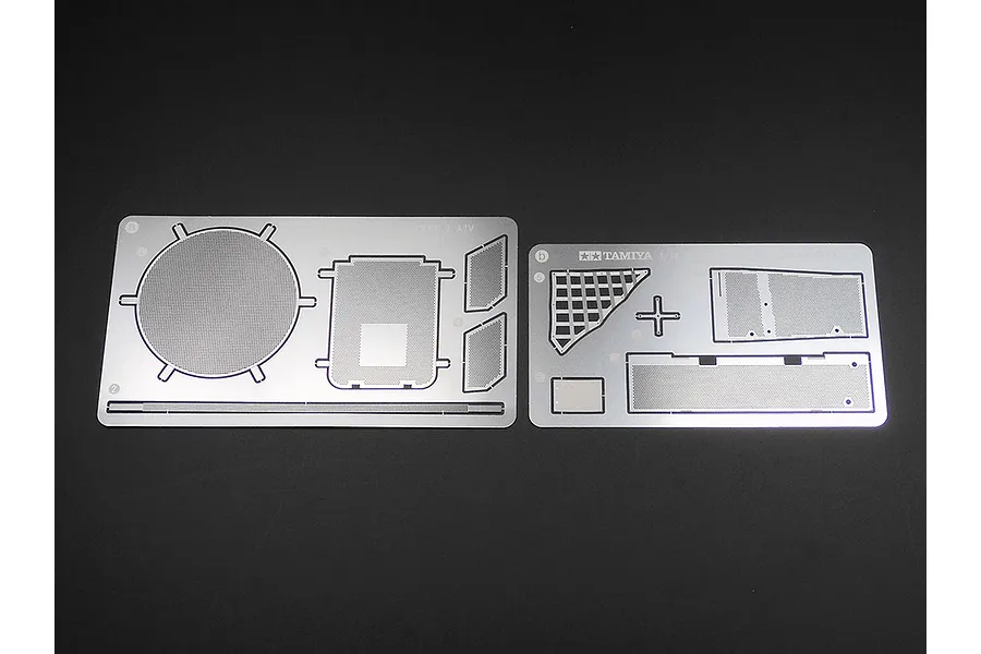 Two photo-etched metal detail sheets for the Tamiya 1/16 Leopard 2 A7V RC tank kit, featuring mesh engine deck grilles and various structural panels.
