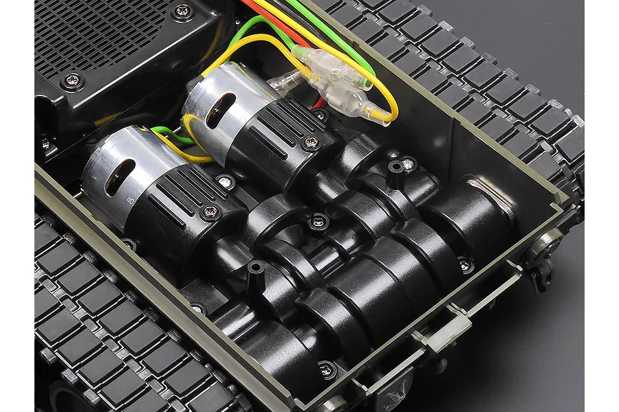 Close-up view of the internal dual motor gearbox assembly inside a Tamiya 1/16 scale RC Leopard 2 A7V tank chassis.