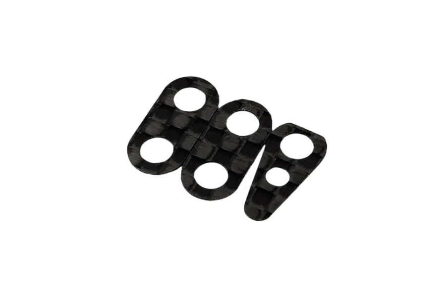 Three carbon fiber weight spacers of varying shapes arranged on a white background.