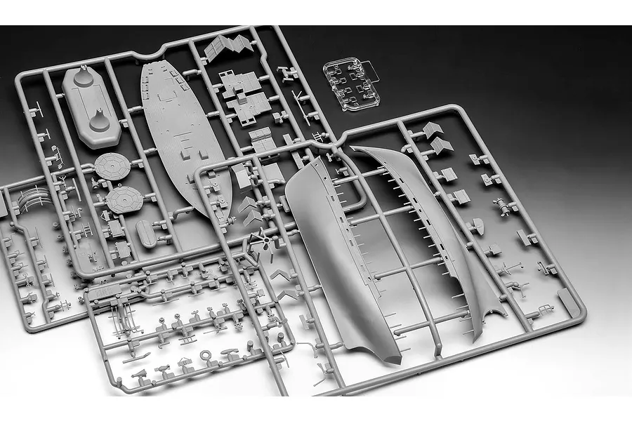 Grey plastic model kit sprue for a 1/144 scale KFK Kriegsfischkutter ship, showing hull sections and various deck components.