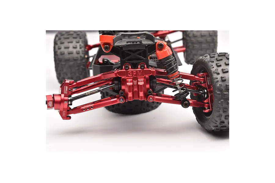 A close-up view of a red aluminium front differential cover and suspension assembly installed on an RC vehicle, featuring GPM Racing branding.