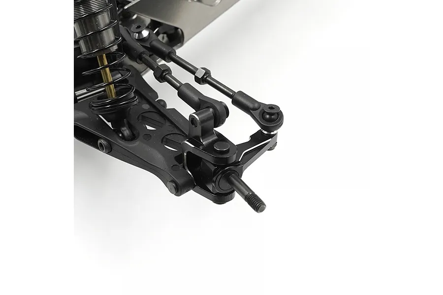 Close-up of an RC car front suspension assembly featuring black aluminium steering knuckles and suspension links on a white background.