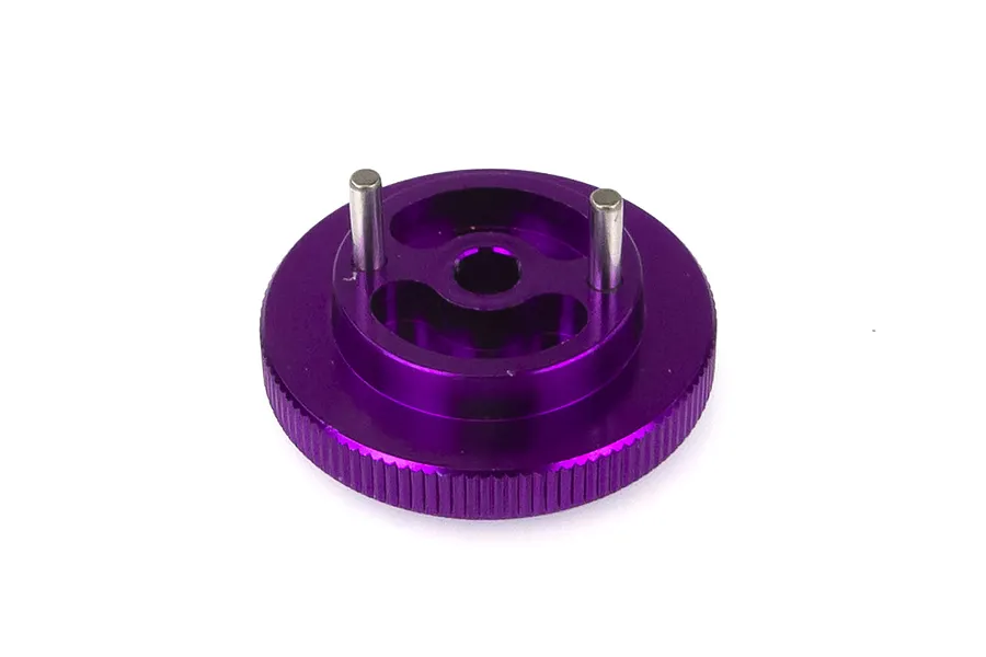 A purple anodized aluminium 2-pin flywheel for an RC nitro engine, shown from a top-down angle against a white background.