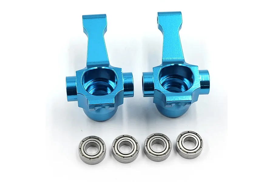 Two bright blue anodized aluminium RC front steering hubs with four small metal ball bearings arranged in a row below them on a white background.