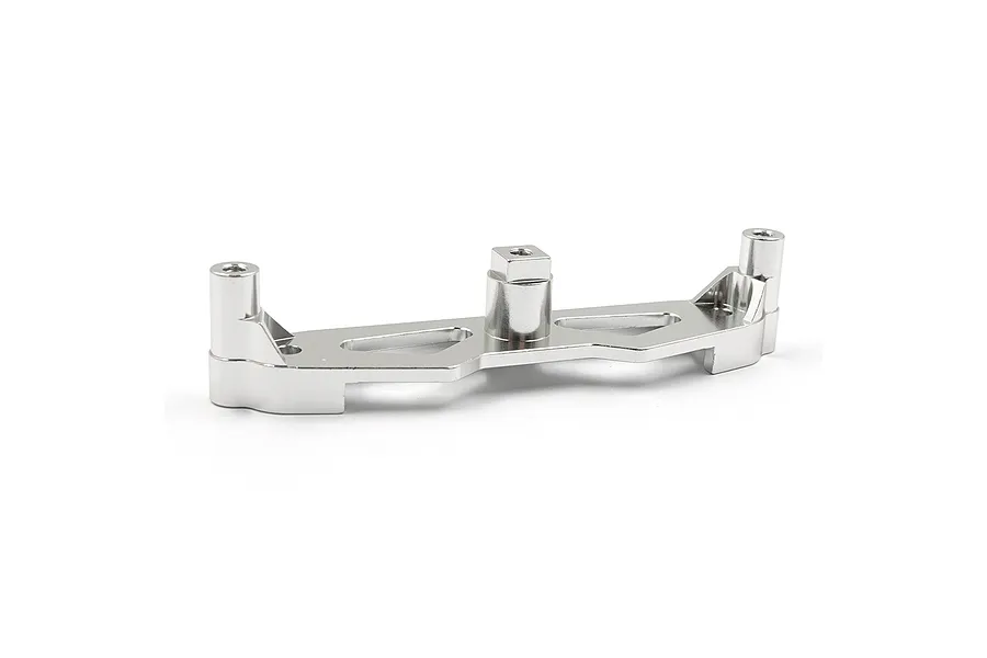 A silver aluminium front shock tower for an RC car, featuring a machined design with mounting points, isolated against a plain white background.
