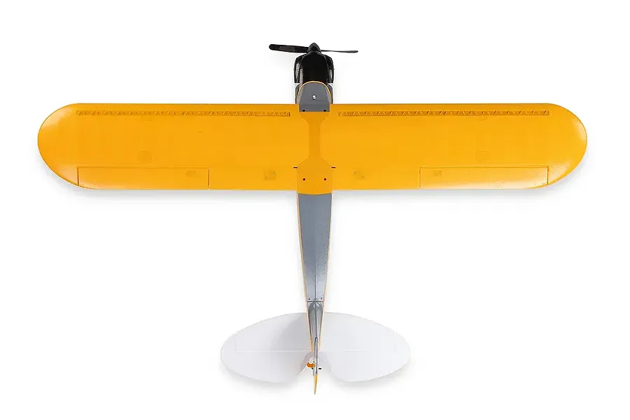 Top-down view of the HobbyZone Carbon Cub S 2 1.3m RC plane in yellow and grey, showing wings, fuselage, and tail section.