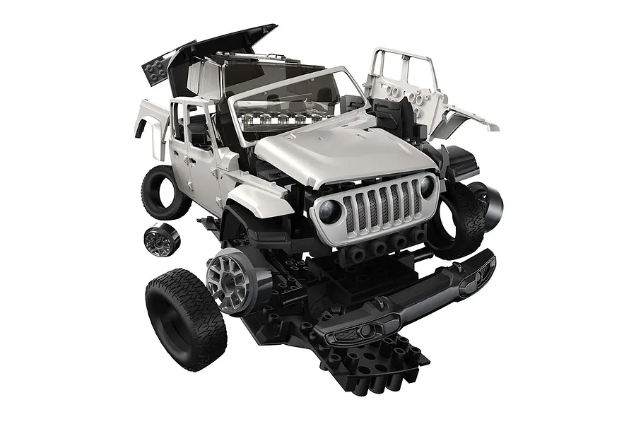 Exploded view of an Airfix Jeep Gladiator Quickbuild model kit showing individual plastic components separated in mid-air.