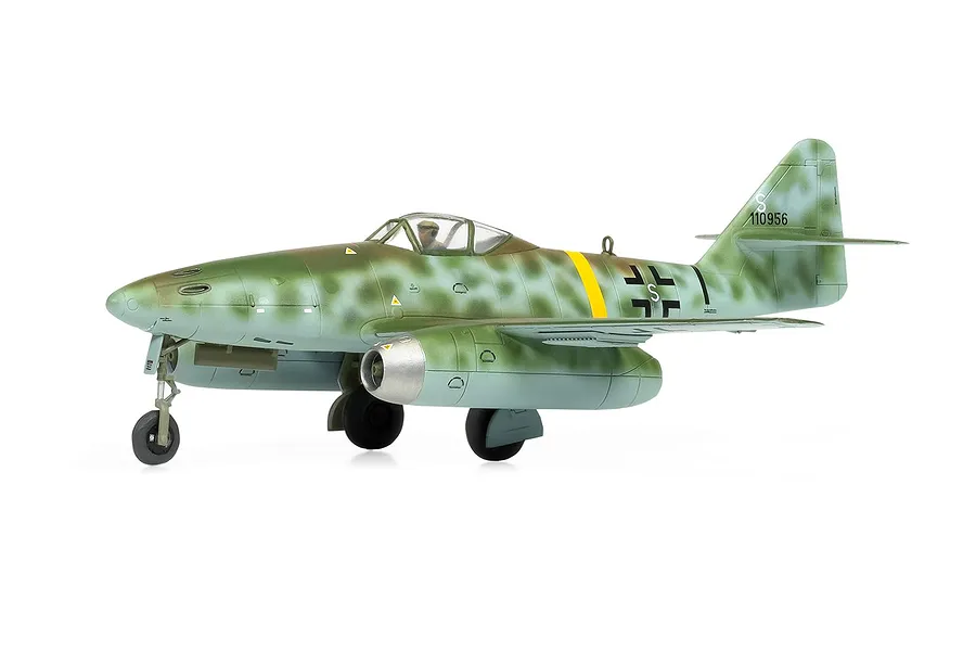 A side-profile studio shot of a completed 1/72 scale Airfix Messerschmitt Me 262 model aircraft with green camouflage paint and a yellow fuselage band.