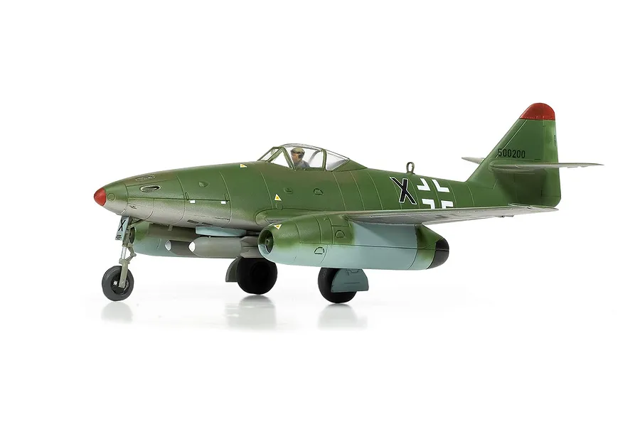 A completed 1/72 scale plastic model of a Messerschmitt Me 262 fighter jet, painted in green and light blue camouflage with German markings.