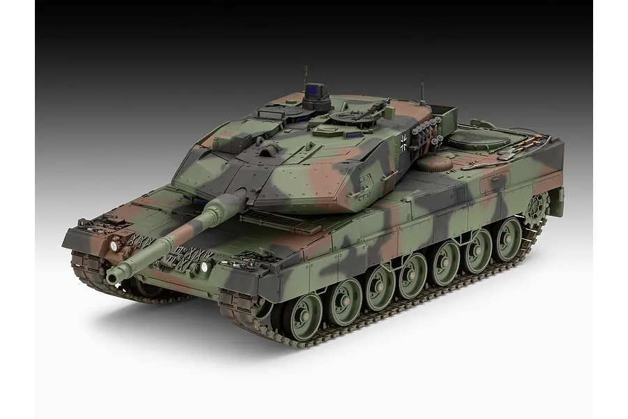 A high-angle studio shot of a fully assembled and painted Revell 1/35 scale Leopard 2A6M+ tank model, featuring a three-tone camouflage pattern.