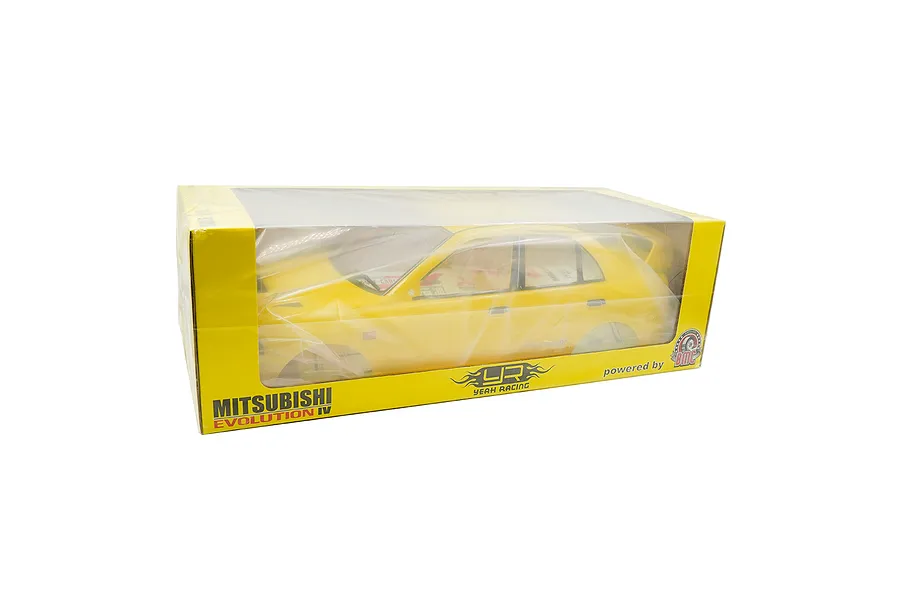 A yellow 1/10 scale Mitsubishi Lancer Evolution IV RC body shell by Yeah Racing, packaged in a yellow cardboard box with a clear plastic window.