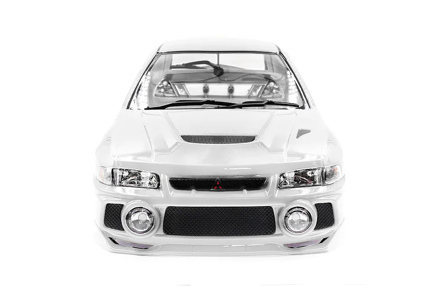 Front view of a white 1/10 scale Mitsubishi Lancer Evo IV RC car body shell with detailed headlights, grille, and fog lights.
