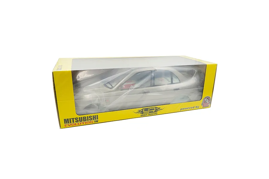 A silver Mitsubishi Lancer Evolution IV RC car body shell in its original yellow and clear window packaging.