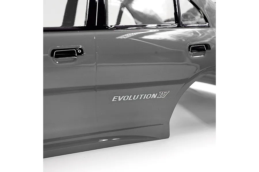 Close-up of the side panel of a silver painted RC Mitsubishi Lancer Evolution IV body shell, showing the Evolution IV decal.