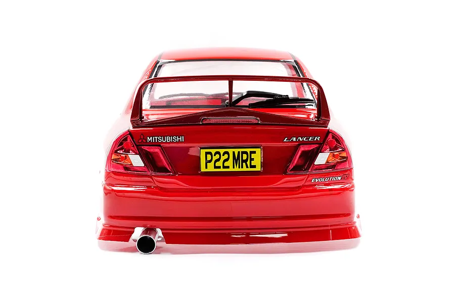 Rear view of a red 1/10 scale Mitsubishi Lancer Evolution IV RC car body shell with a rear spoiler, exhaust pipe, and yellow license plate.