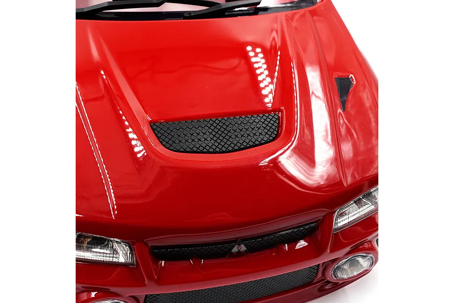 Close-up of the red hood and front bumper of a 1/10 scale Mitsubishi Lancer Evo IV RC body shell.