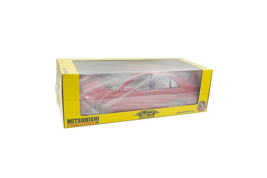 A red 1/10 scale Mitsubishi Lancer Evolution IV RC body shell inside a yellow and clear plastic display box.