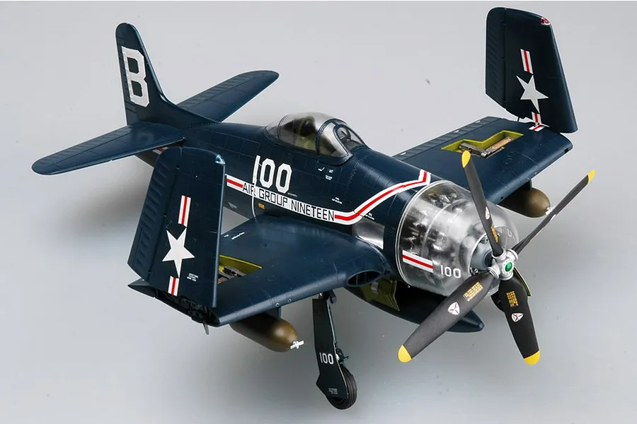 A completed 1/32 scale plastic model kit of a US Navy F8F-1 Bearcat fighter plane with folded wings and a clear engine cowling.