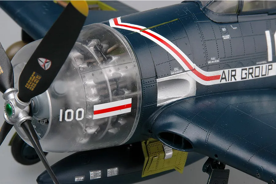 Close-up of a 1/32 scale Trumpeter F8F-1 Bearcat model aircraft, showing the engine cowl, propeller, and fuselage markings.