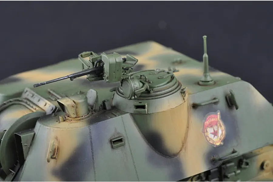 Close-up of the turret and machine gun of a painted 1/35 scale Soviet 2S3 self-propelled gun model kit.