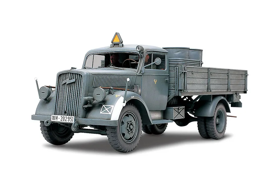 A fully assembled and painted 1/35 scale Tamiya German 3 Ton 4x2 cargo truck model, featuring a grey finish, cargo bed, and military markings.