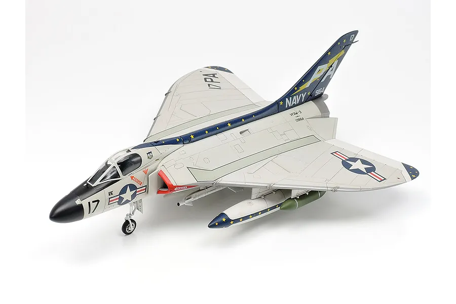 A fully assembled and painted 1/72 scale plastic model of a US Navy Douglas F4D-1 Skyray jet fighter, shown from a high-angle side view.