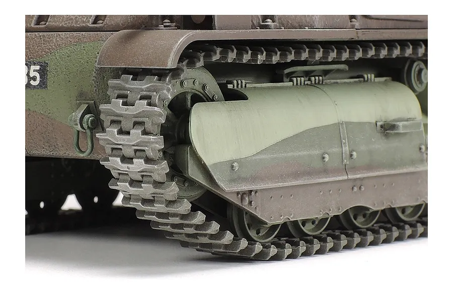 Close-up of the tracks and side armor of a Tamiya 1/35 scale Somua S35 tank model kit with camouflage paint.