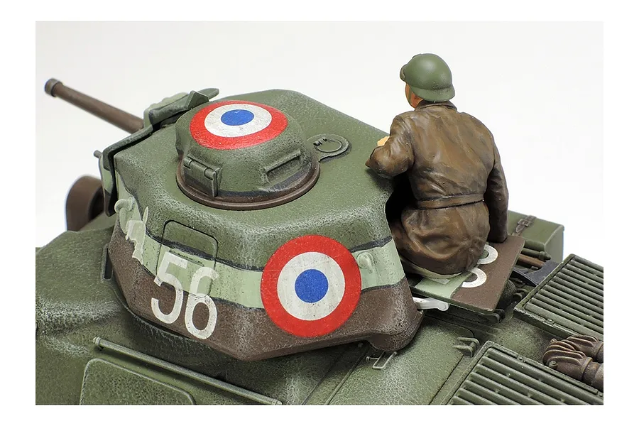 Close-up of a painted 1/35 scale French Somua S35 tank model showing the turret, French roundel markings, and a tank commander figure.