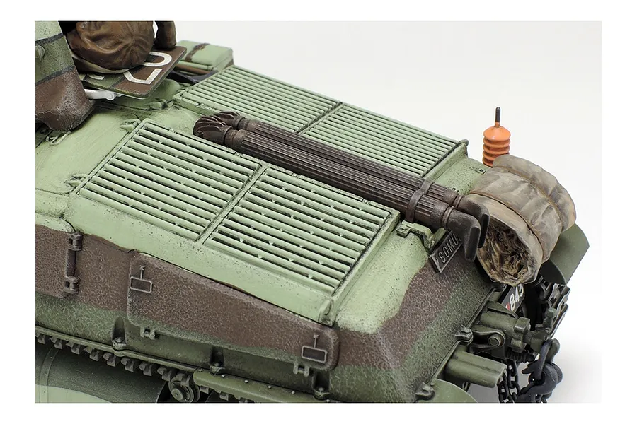 Close-up of the rear deck of a painted 1/35 scale Tamiya Somua S35 tank model, showing engine grilles, tools, and a rolled tarp.