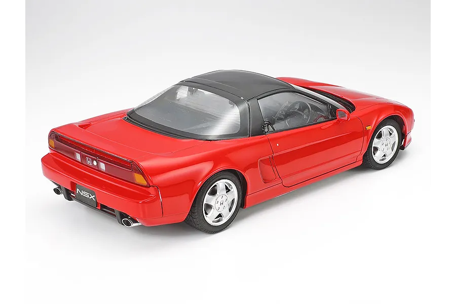 A high-angle rear three-quarter view of a red Tamiya 1/24 scale Honda NSX plastic model car on a white background.