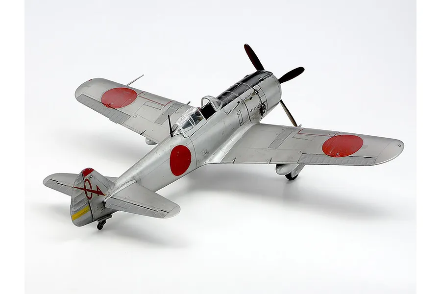A finished 1/48 scale model of a silver Nakajima Ki-84 Hayate fighter plane with red roundels on a white background.