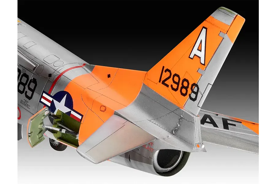 Close-up of the rear fuselage and tail section of a 1/48 scale F-86D Dog Sabre model aircraft with silver and orange paint scheme.