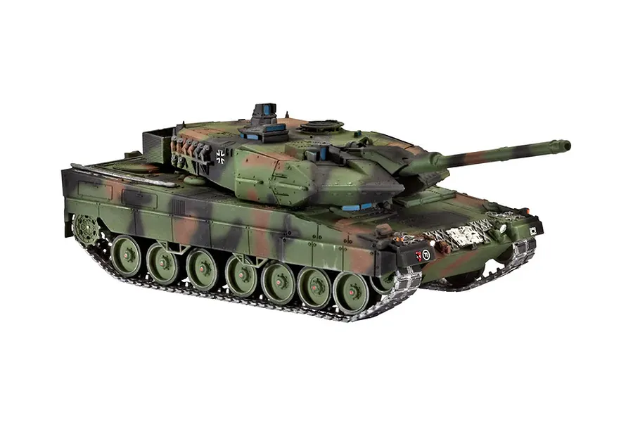 A fully assembled and painted 1/72 scale model of a Leopard 2A6 tank in camouflage livery, viewed from a high-angle front-quarter perspective.