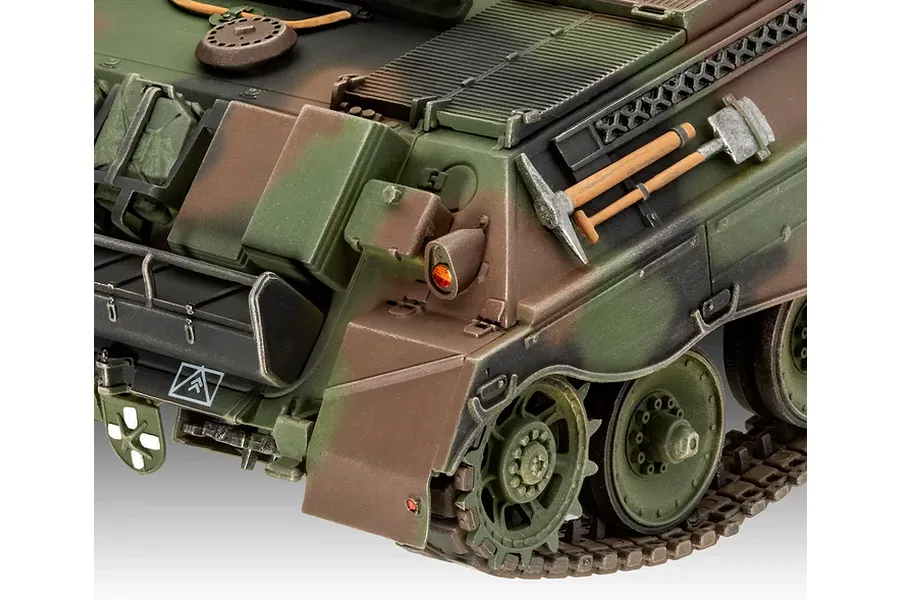 Close-up of the rear section of a camouflaged Raketenjagdpanzer Jaguar 1 plastic model tank showing tools and tracks.