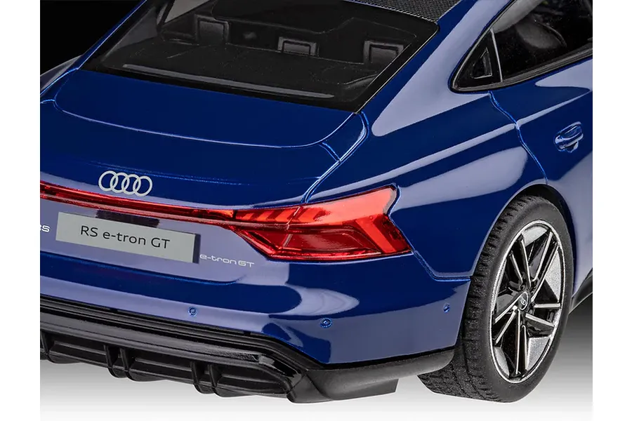 Close-up of the rear of a blue Revell 1/24 scale Audi RS e-tron GT plastic model car showing the tail light, Audi logo, and license plate.