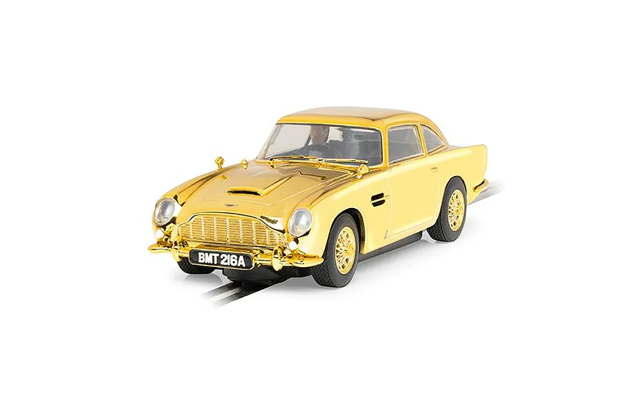 A 1/32 scale Scalextric Aston Martin DB5 slot car finished in a reflective gold chrome, featuring the iconic BMT 216A license plate.