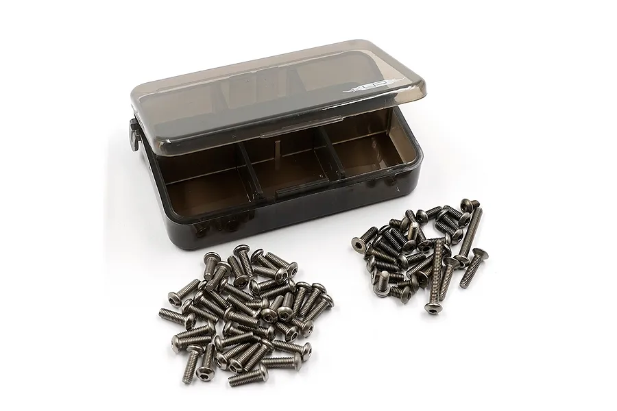 A set of metallic RC screws arranged in two piles next to a small, translucent grey plastic storage box with the Yeah Racing logo.