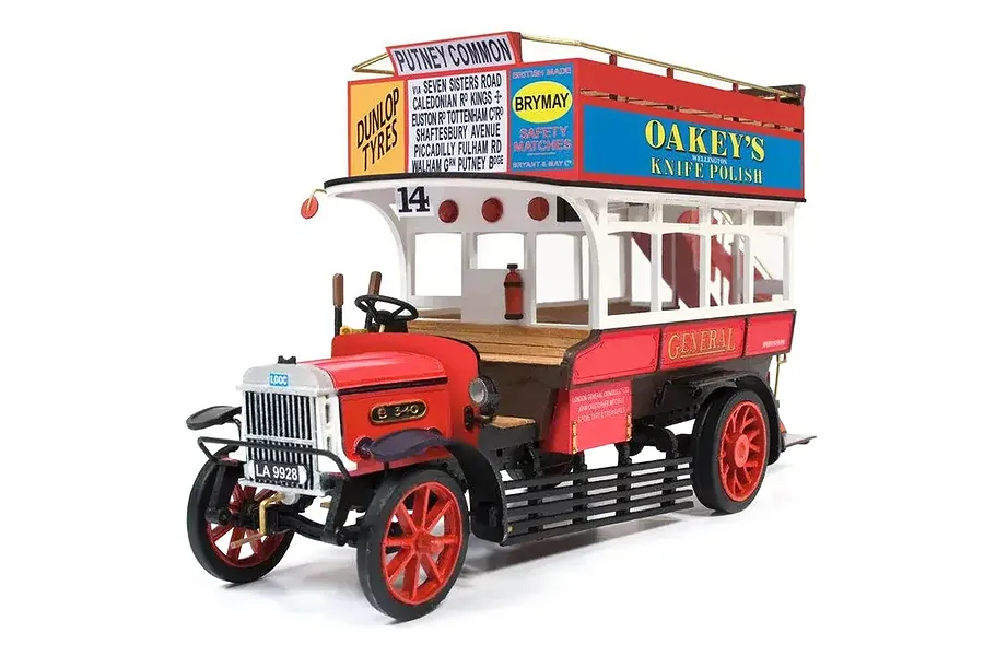 A detailed 1/24 scale model of an AEC B-Type London bus, featuring red and white paint, advertising signage, and intricate wooden and metal detailing.