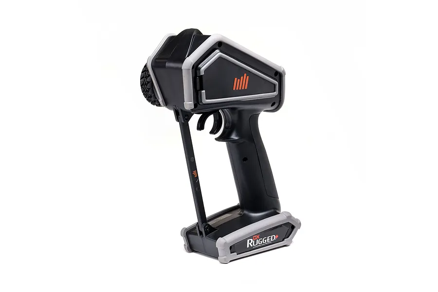 Spektrum DX Rugged+ 12-channel RC transmitter in black and grey with a protective bumper design, viewed from the side against a white background.