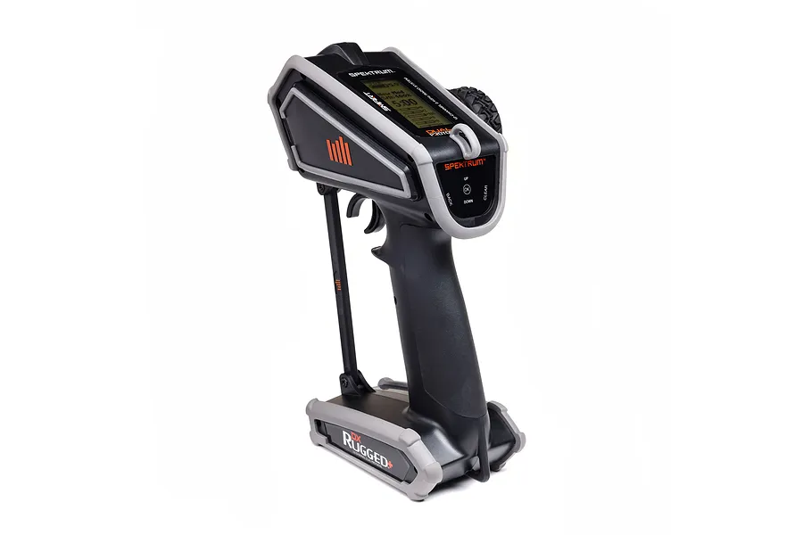 Spektrum DX Rugged DSMR+ 12-channel surface radio transmitter in black and grey with orange accents, shown from a side angle.