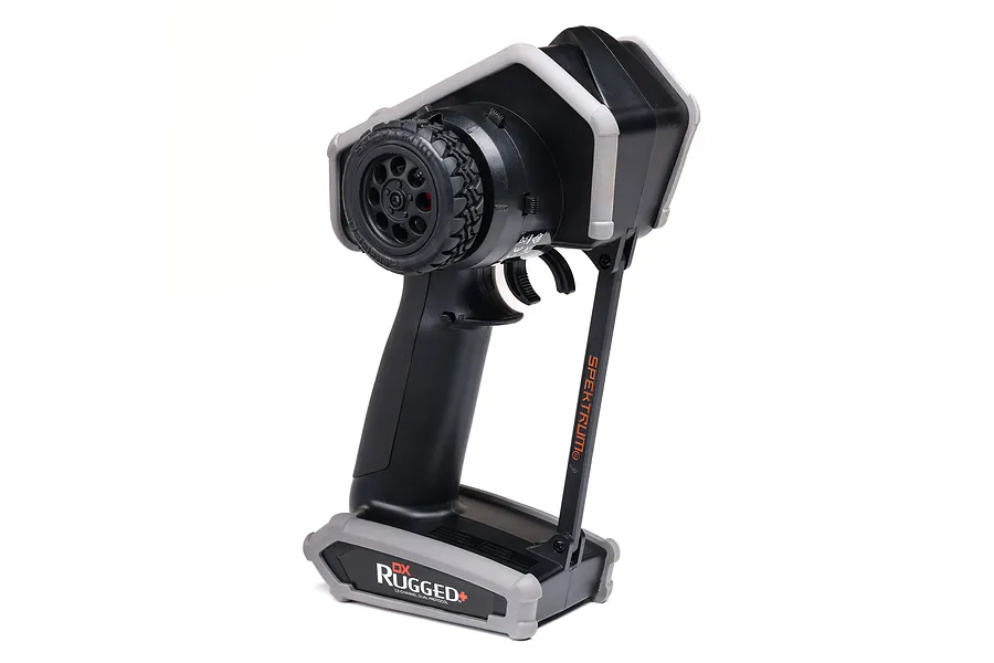 Spektrum DX Rugged+ 12-channel RC transmitter with a black and grey protective chassis, shown from a side angle against a white background.