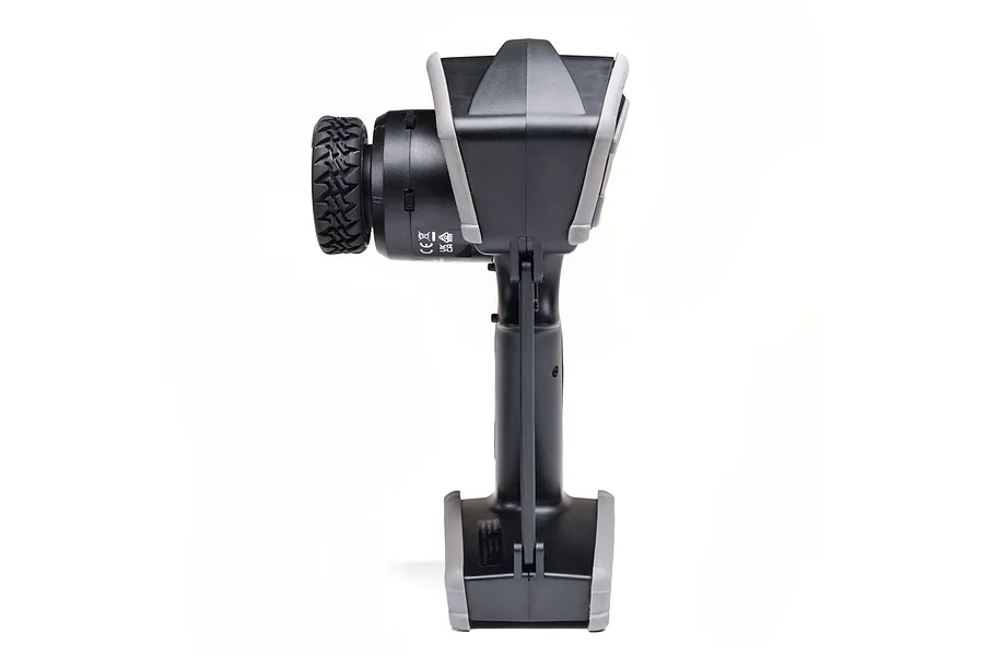 Side profile view of a black and grey Spektrum DX Rugged RC transmitter showing the steering wheel and handle.