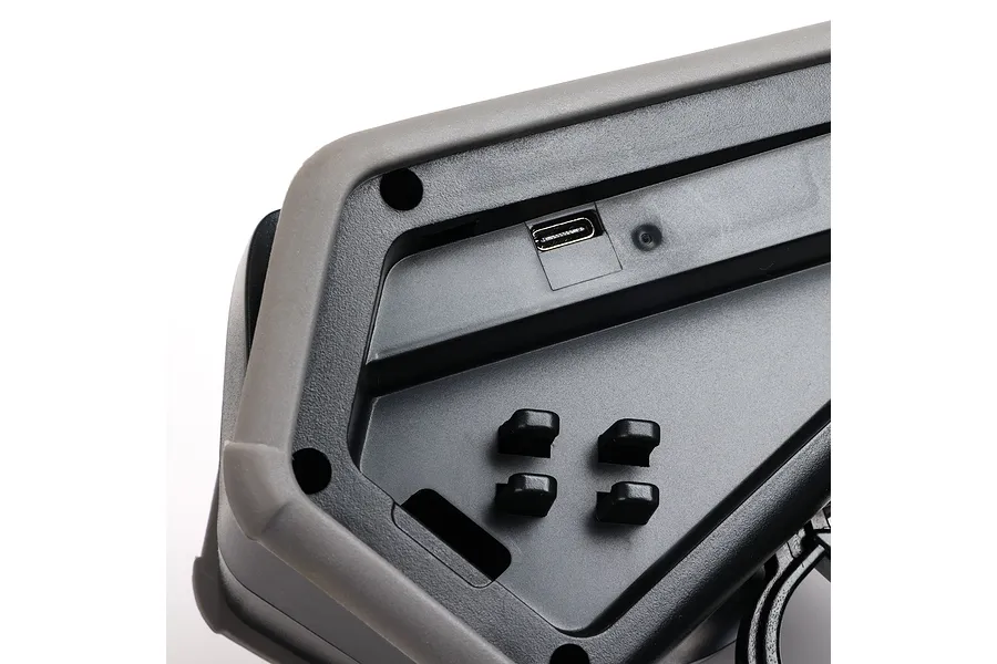 Close-up of the base of a Spektrum DX Rugged transmitter showing the USB-C charging port and rubberized protective bumper.