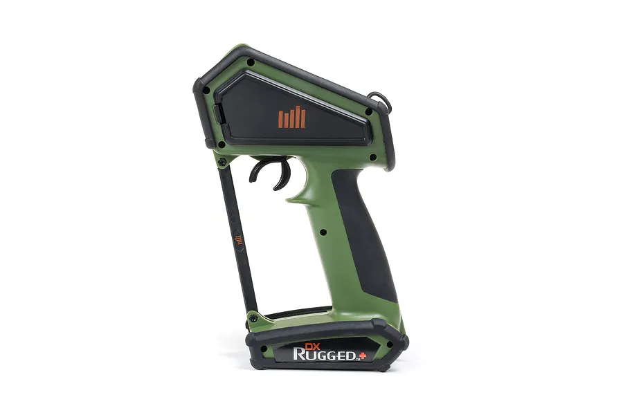 Side profile of a green and black Spektrum DX Rugged+ RC transmitter on a white background.